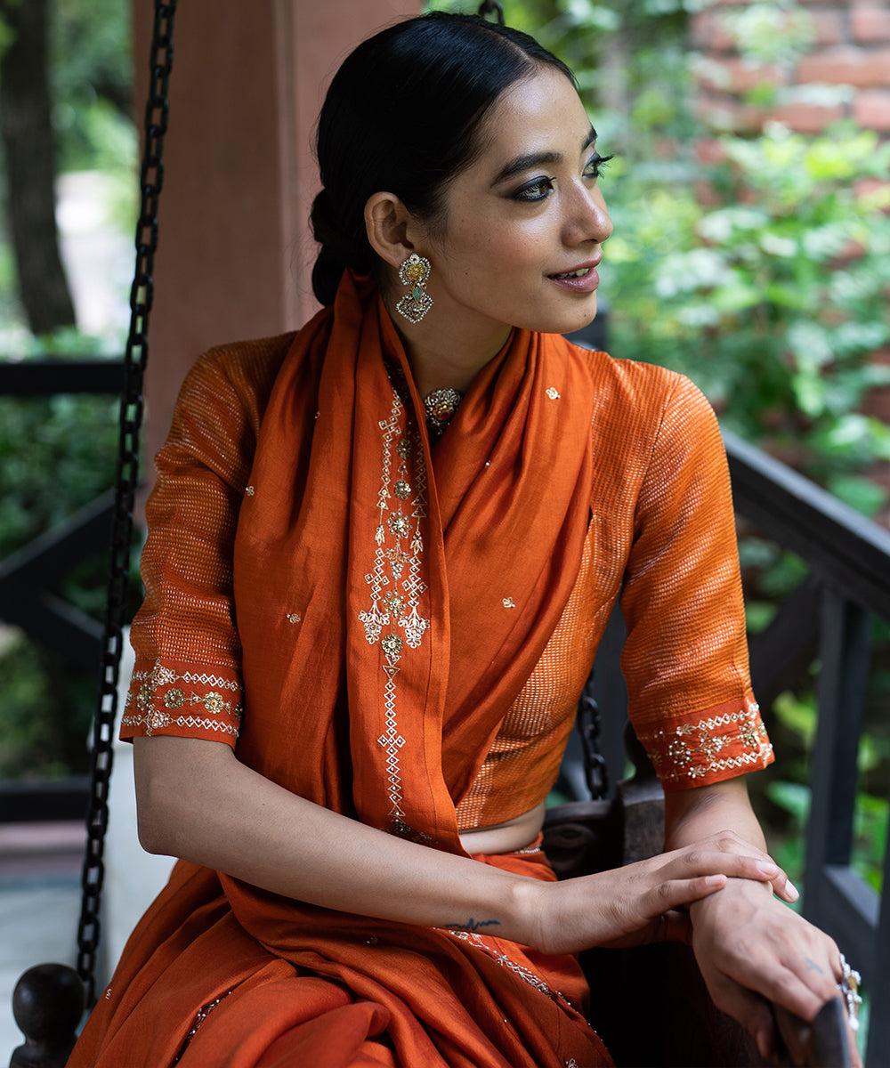 Rust Orange hand embroidered silk saree