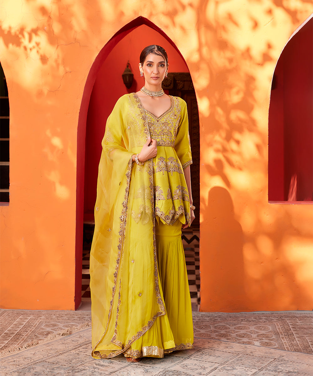 Yellow embroidered raw silk
kurta sharara set
