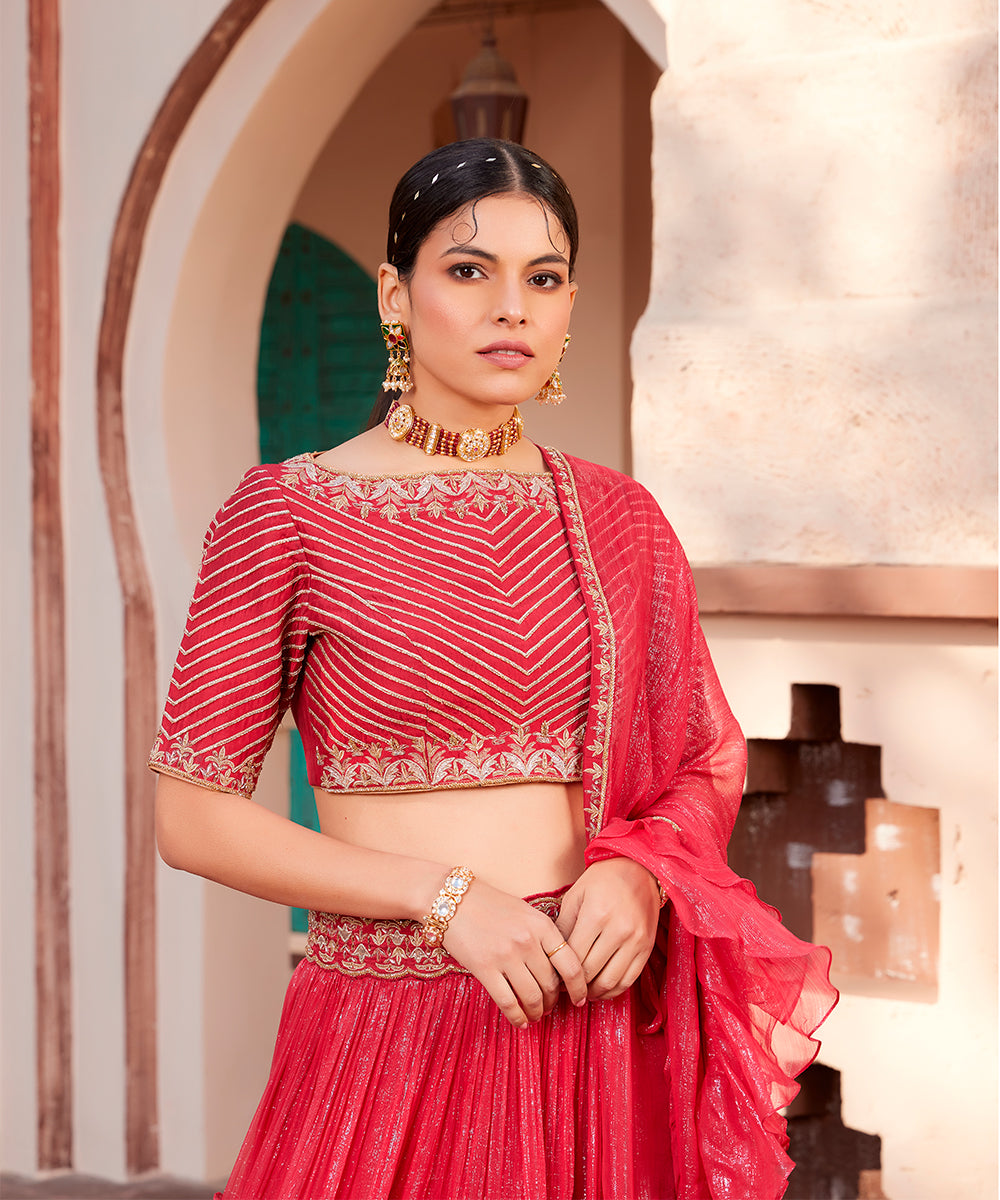 Red embroidered shimmer 
layered lehanga set