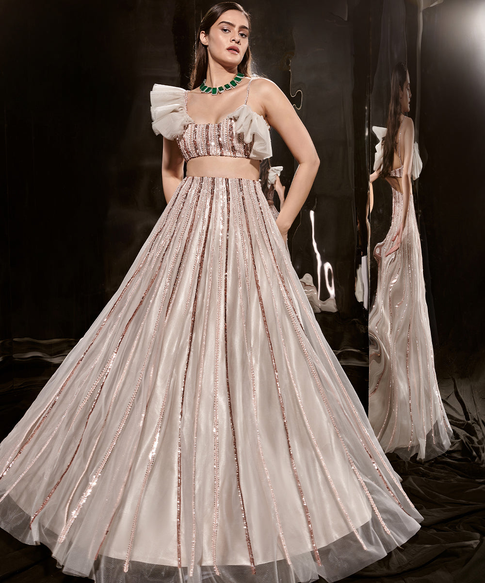 Silver embroidered lehenga with ruffle blouse