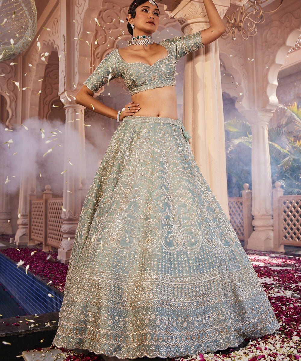 Margrette: Dusty Firoza Heavily Hand Embroidered Lehenga