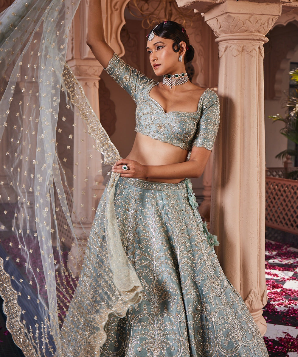 Margrette: Dusty Firoza Heavily Hand Embroidered Lehenga